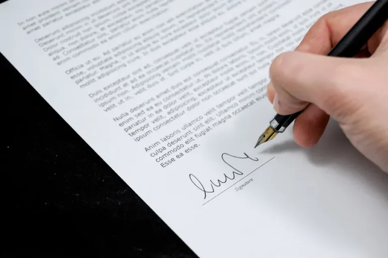 Hand signing a document